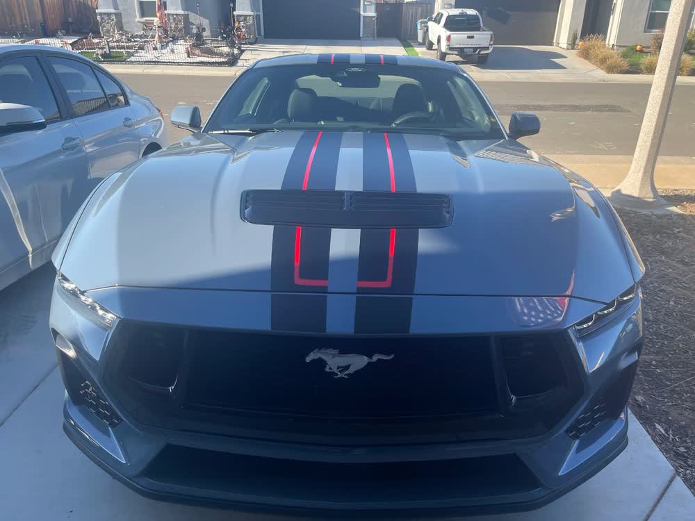 Ford Mustang with blue and red racing stripes